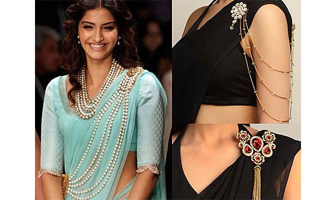 Sonam Kapoor wearing a saree with a brooch pin. 