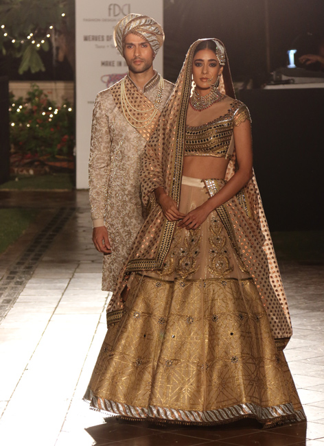 A wedding ensemble with a shimmer finishing by JJ Valaya