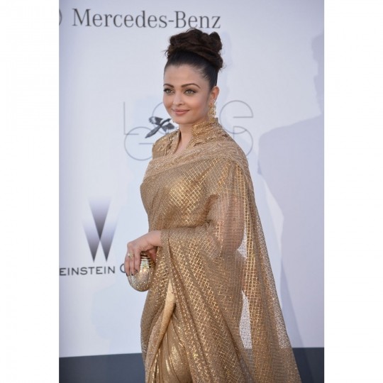 Aishwarya with a golden clutch