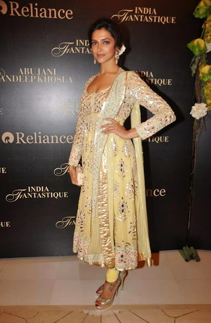 Deepika Padukone in Yellow colored Georgette Anarkali Suit with heavy Zardosi work fully embroidered and Golden borders.