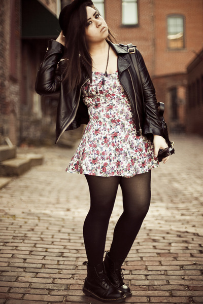The model has paired her floral dress with the jacket and transparent leggings.