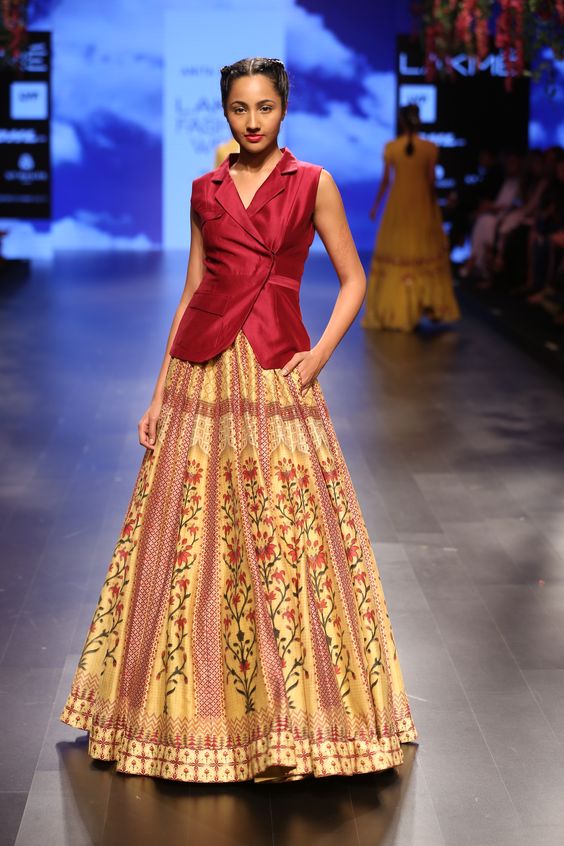 The model in Maroon color blazer with printed Lehenga.