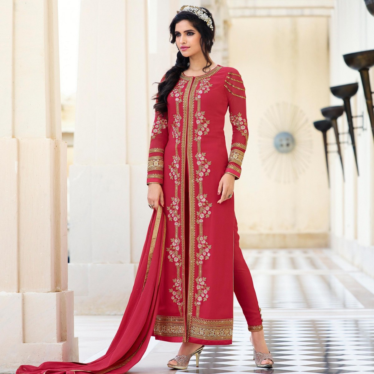 The model is wearing Red High Neck Churidar Suit.