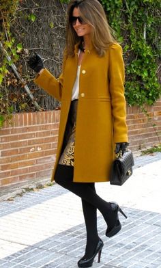 Overcoat paired with white shirt and a midi skirt 