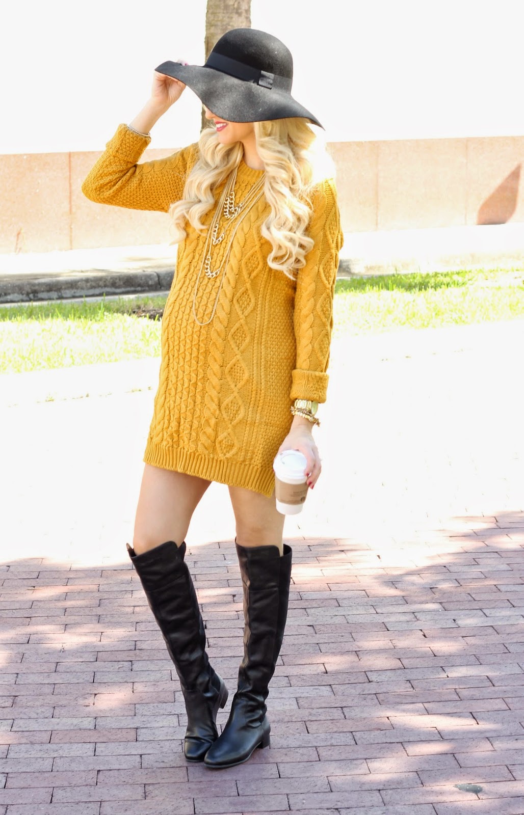 Sweater dress paired with knee high boots