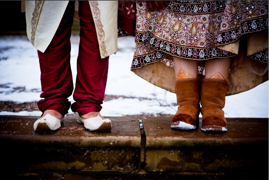Indian couple wearing traditional dress with gorgeous shoes.