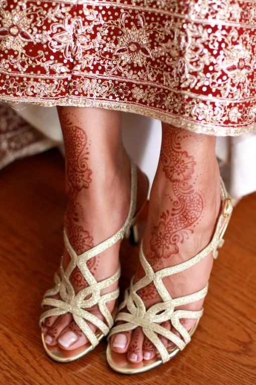 The model is wearing traditional white shoes.